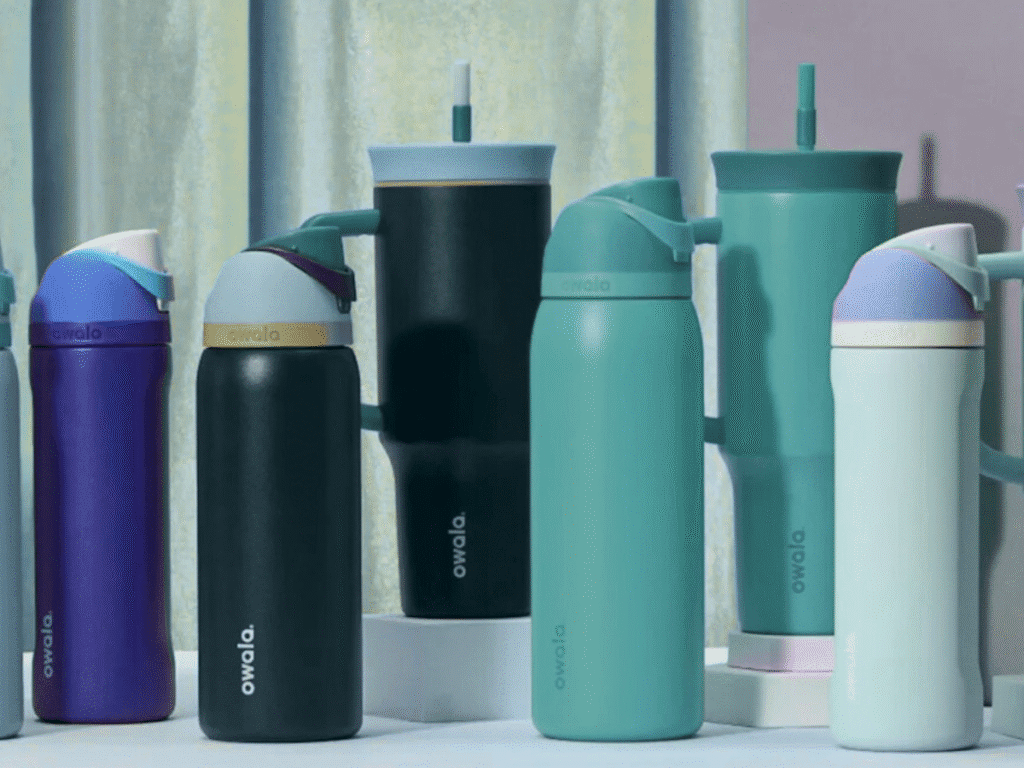 A collection of vibrant stainless steel water bottles in various colors arranged together.